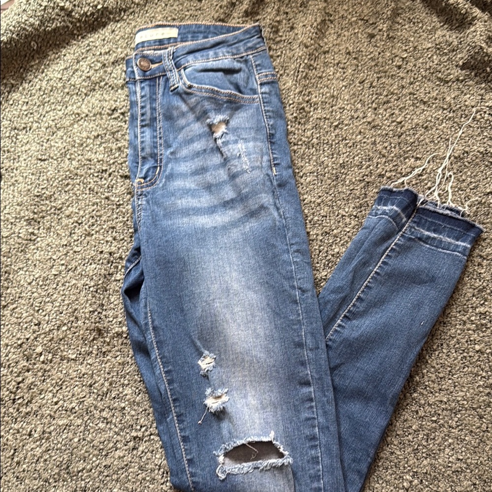 Woman’s Blue Distressed Jeans